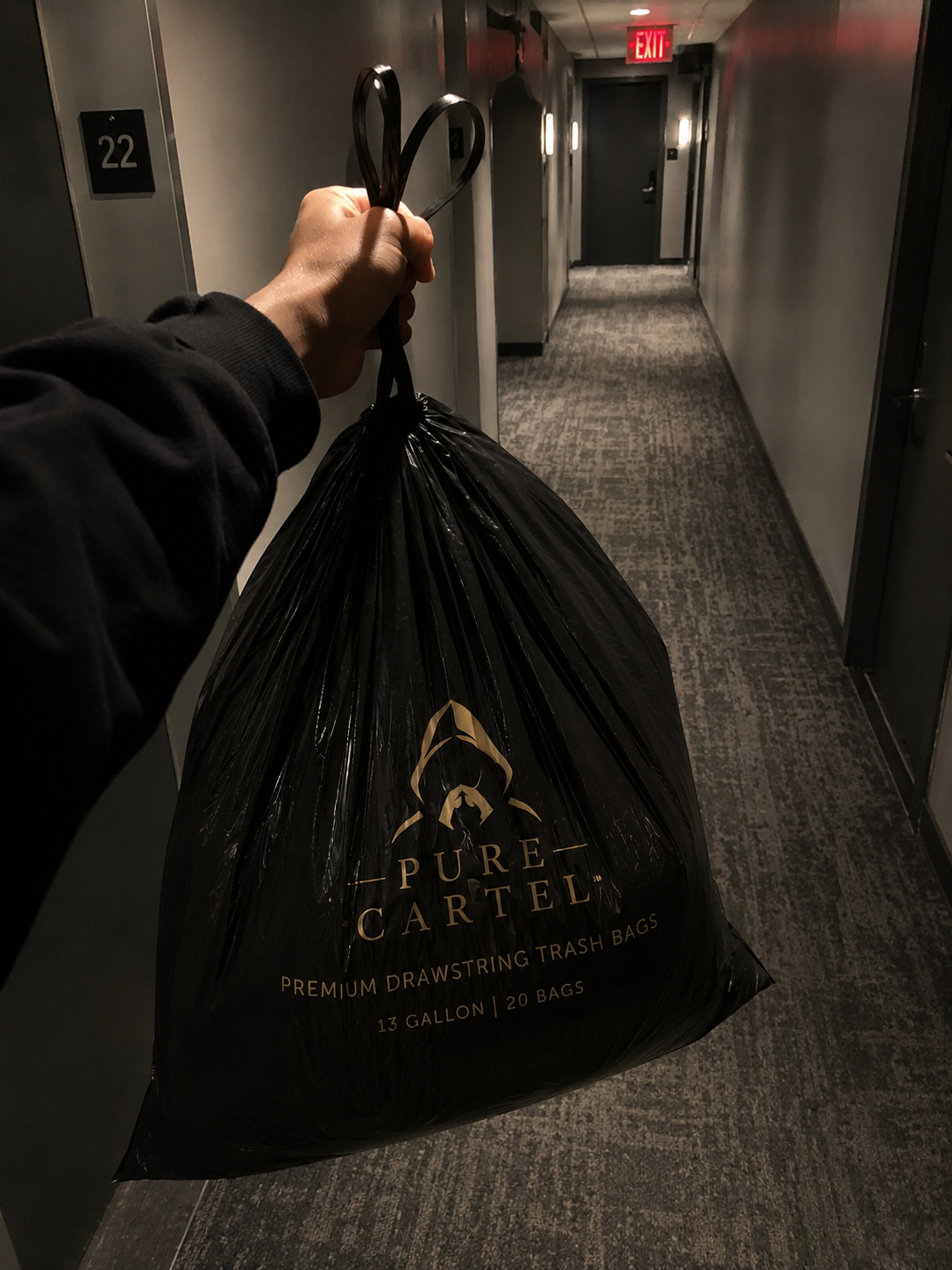 Carrying a liner down an apartment hallway