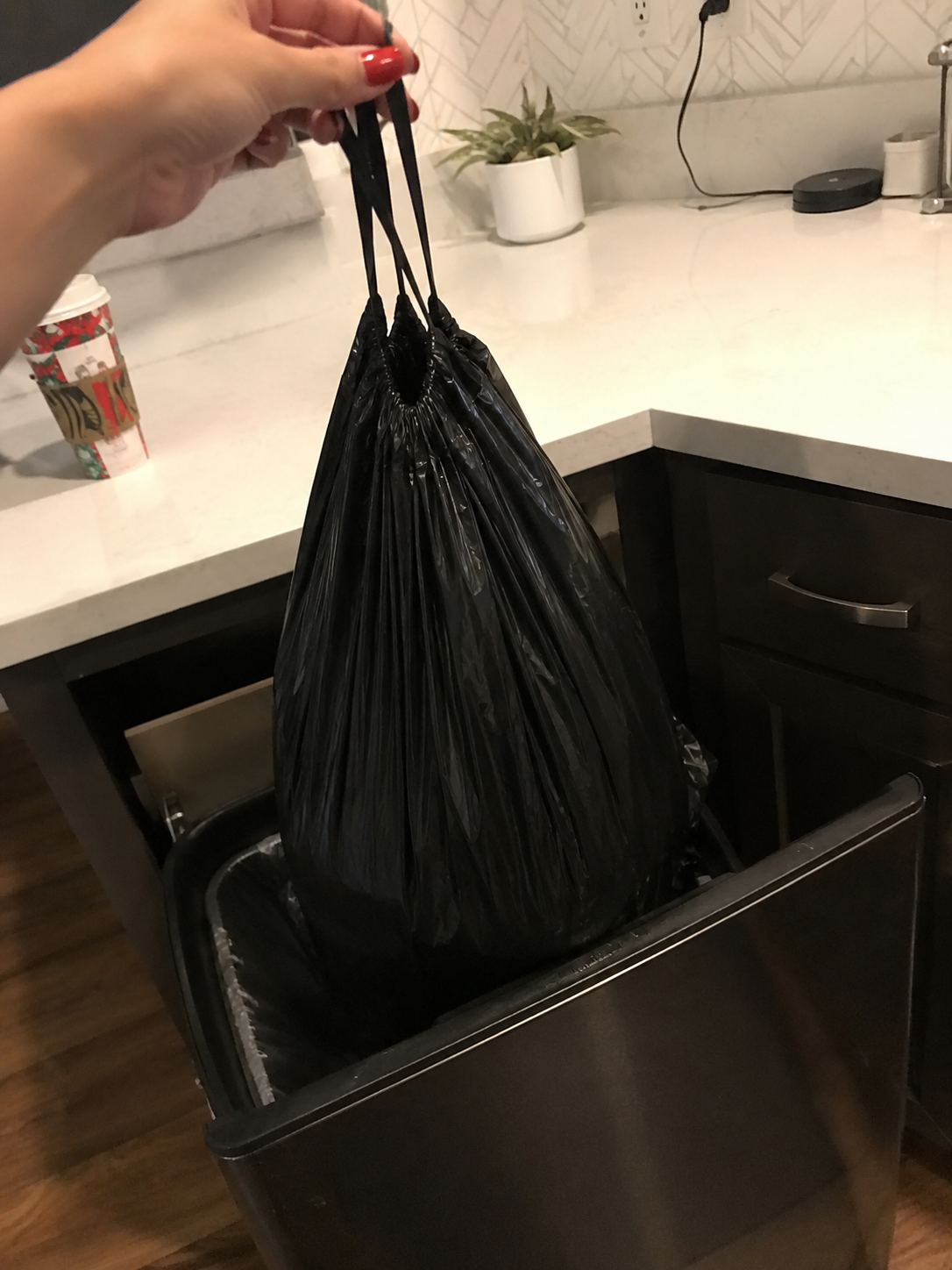 A full liner lifted cleanly from a kitchen bin